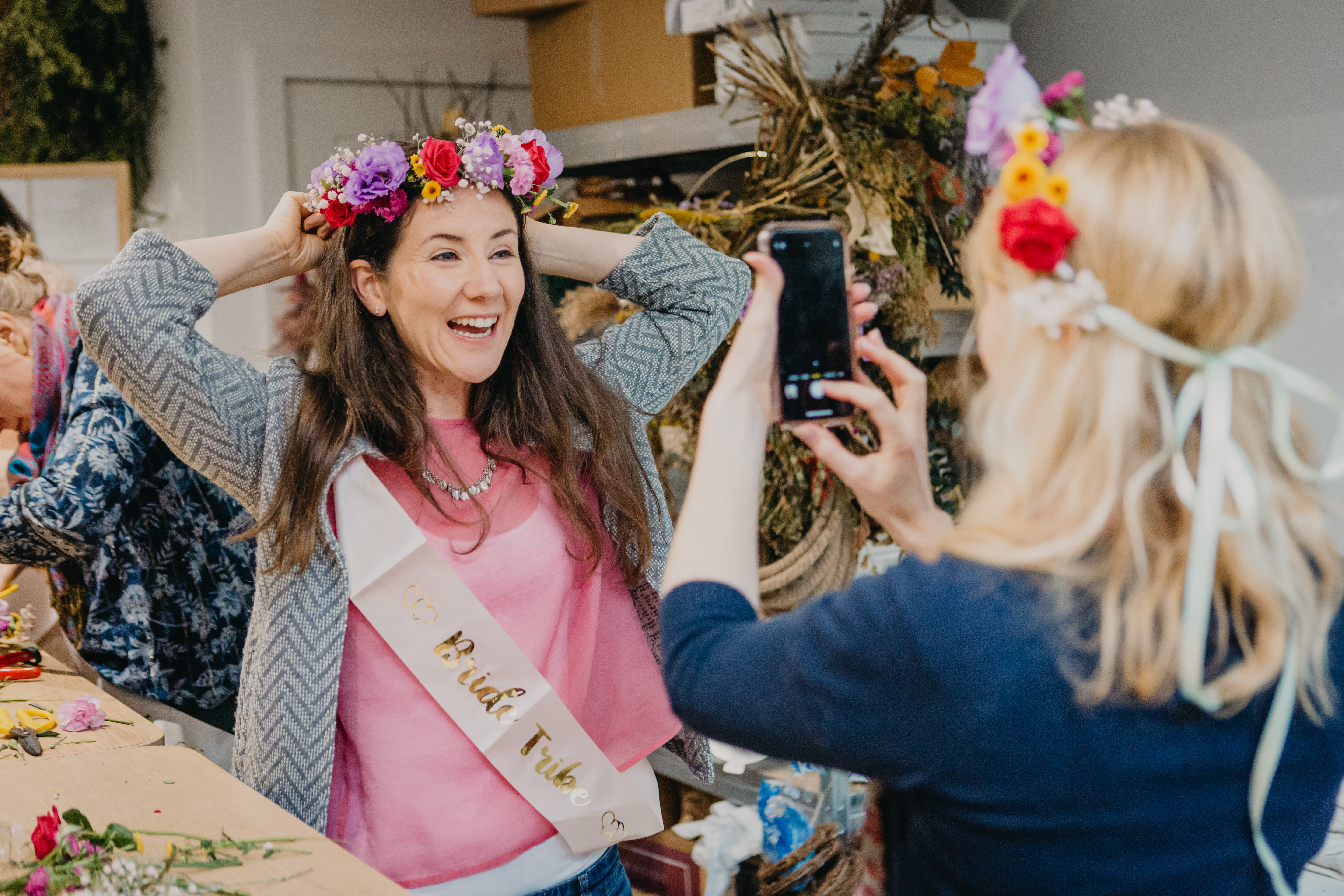 Bridesmaid wearing flower crown smiling for a photo